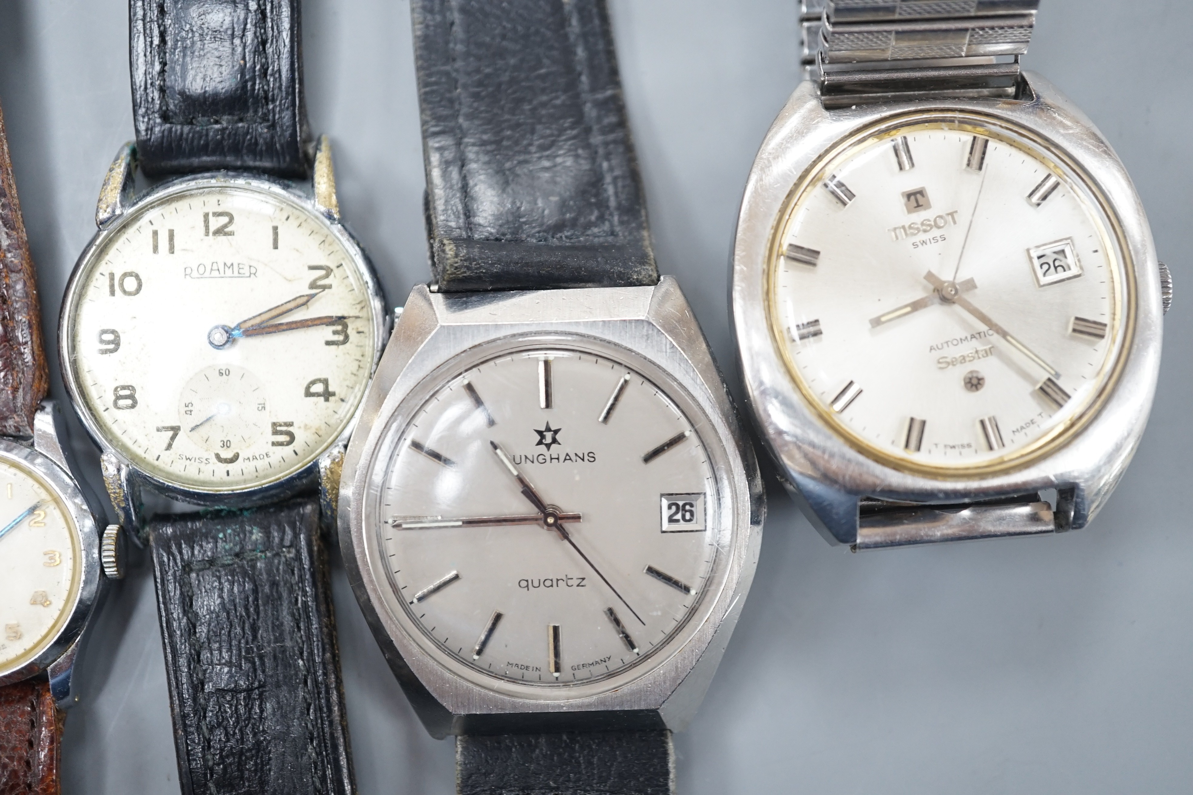 Three assorted gentleman's wrist watches including Junghans quartz, Roamer and Tissot and three lady's watches including Ingersoll and 9ct gold without strap.